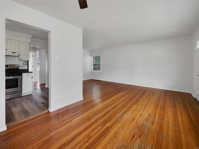 unfurnished living room featuring hardwood / wood-style floors