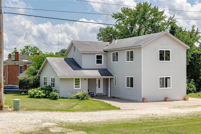 view of property with a front lawn