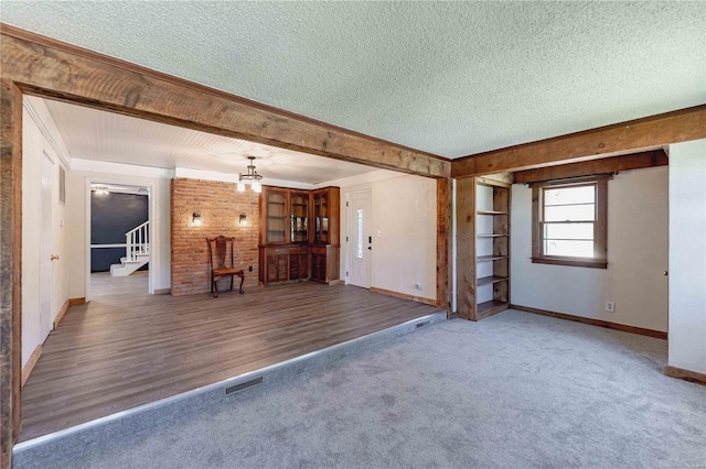 unfurnished living room with a textured ceiling