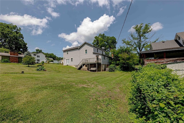 view of yard with a wooden deck