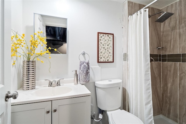 bathroom with vanity, a shower with curtain, and toilet