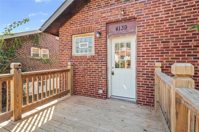 entrance to property featuring a deck