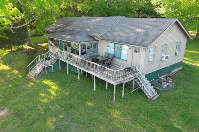 back of house featuring cooling unit, a yard, and a deck