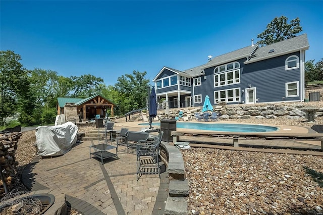 rear view of property featuring a patio