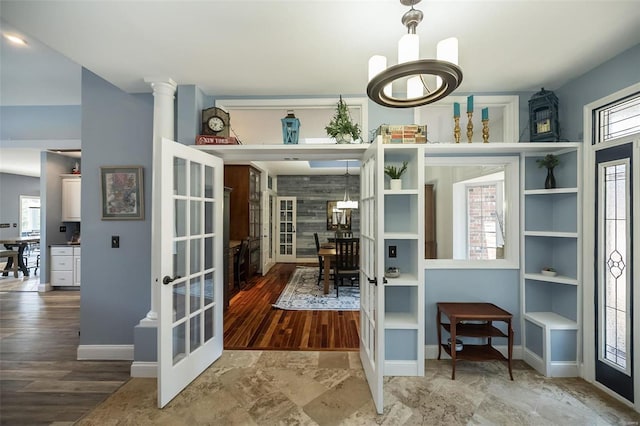 office with a notable chandelier, wood-type flooring, and french doors