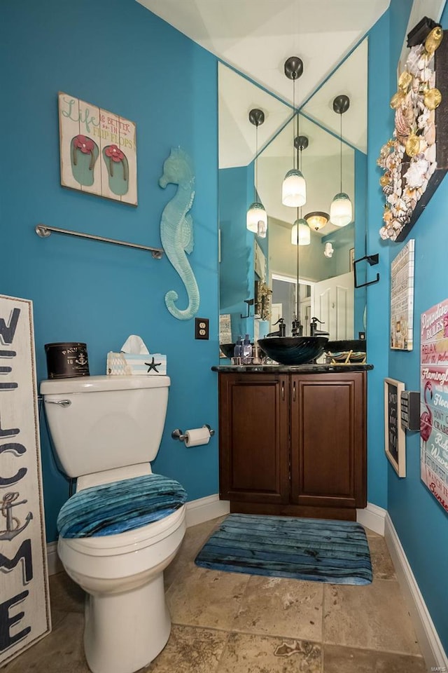 bathroom with vanity, toilet, and tile patterned floors