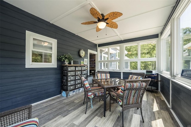 sunroom / solarium featuring ceiling fan