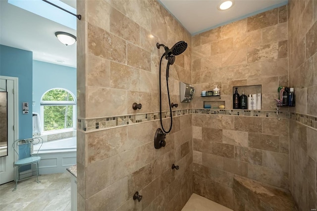 bathroom featuring plus walk in shower and tile patterned flooring