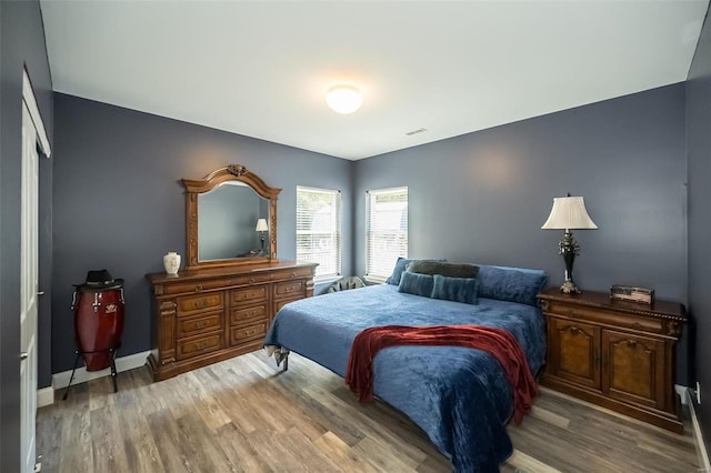 bedroom with light hardwood / wood-style flooring