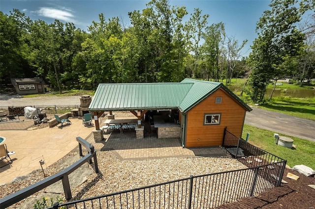 view of patio with a storage unit