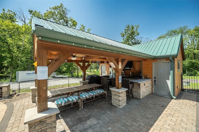 view of patio / terrace with grilling area and a gazebo