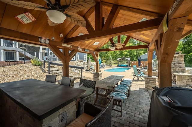 view of patio / terrace with grilling area, ceiling fan, and a gazebo