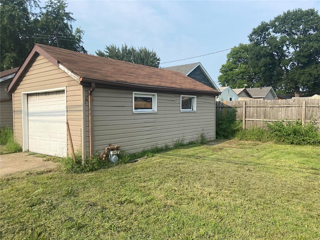 garage with a yard