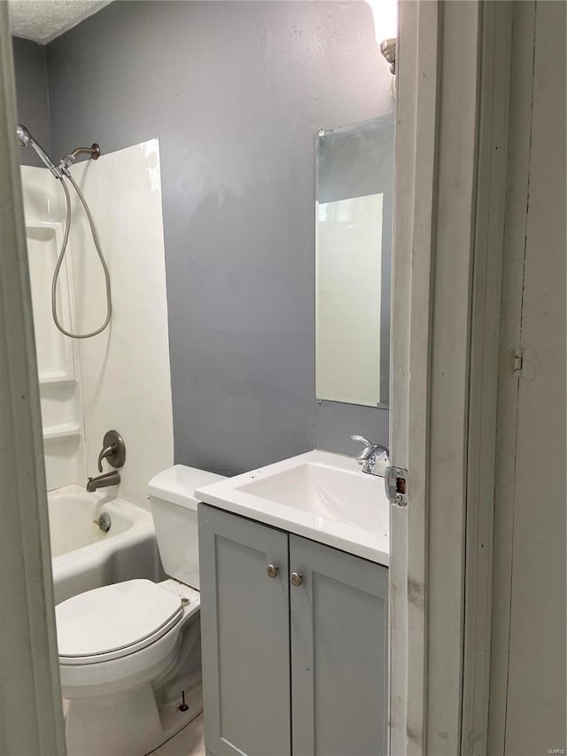 full bathroom featuring vanity, shower / bathing tub combination, and toilet