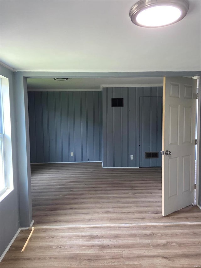 spare room featuring wood-type flooring