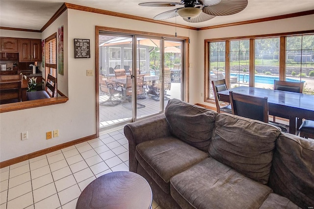 tiled living room featuring ceiling fan and crown molding