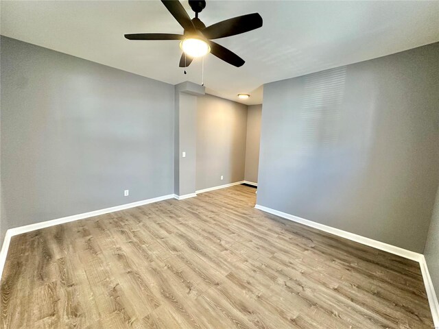 unfurnished room with ceiling fan and light hardwood / wood-style floors