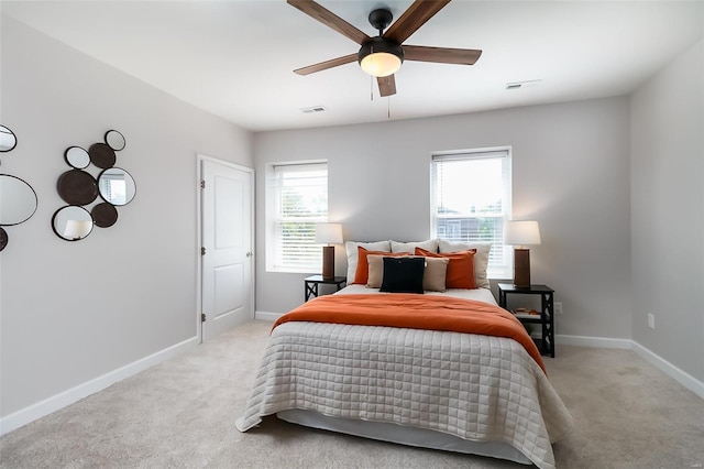 bedroom with light carpet and ceiling fan