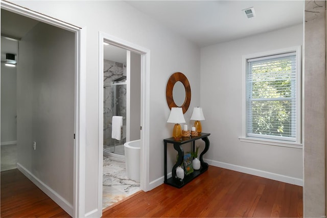 hallway featuring hardwood / wood-style floors