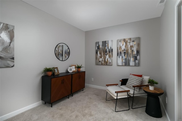 living area featuring light colored carpet