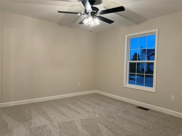 empty room featuring carpet and ceiling fan