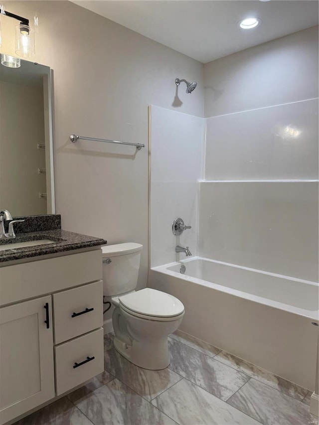 full bathroom featuring vanity, shower / washtub combination, and toilet