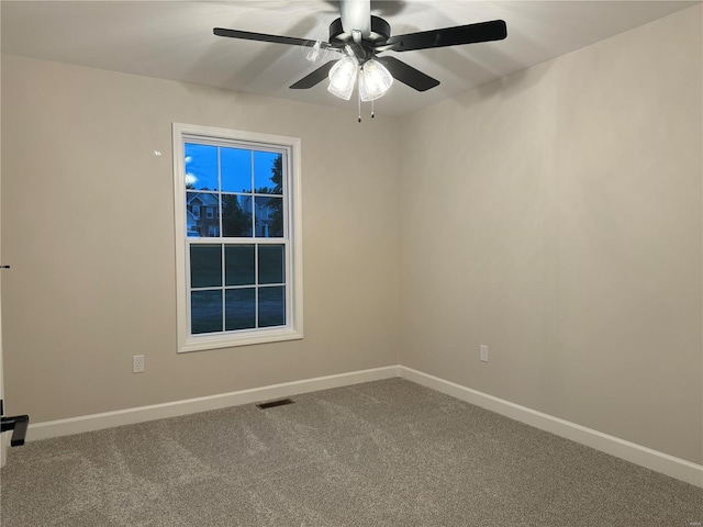 unfurnished room featuring carpet and ceiling fan