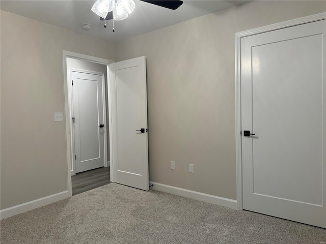 unfurnished bedroom with carpet and ceiling fan