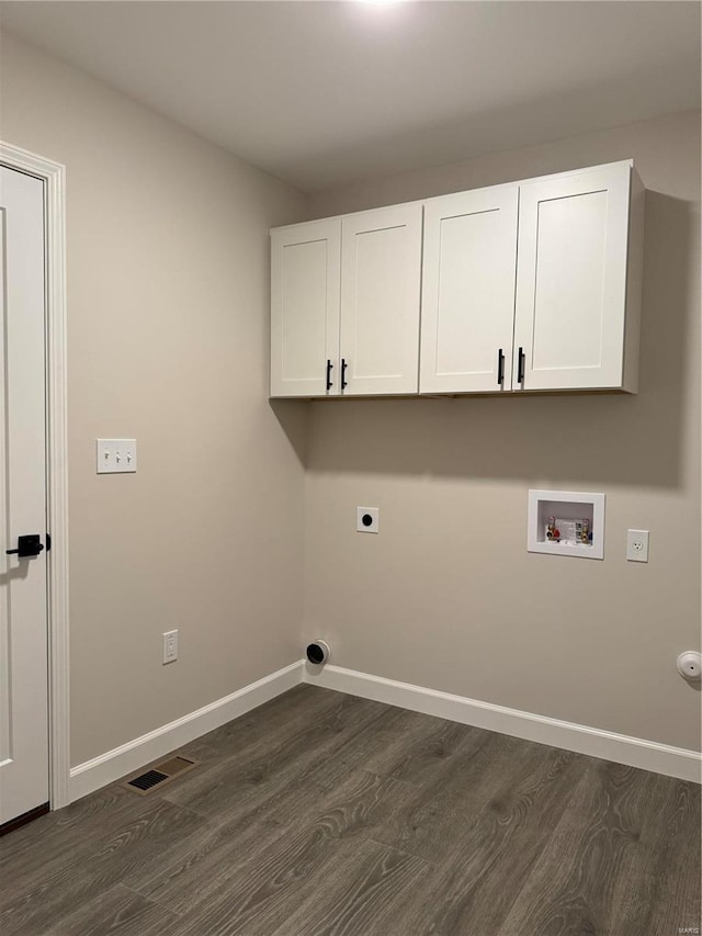 washroom with dark wood-type flooring, electric dryer hookup, cabinets, and hookup for a washing machine