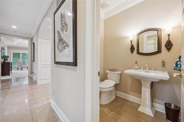 bathroom with ornamental molding, tile patterned floors, and toilet