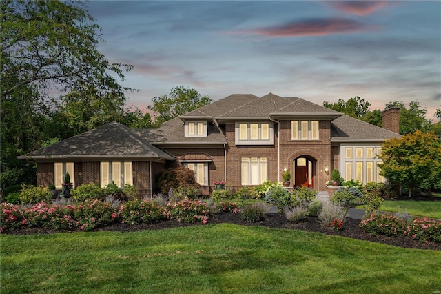 view of front of house with a lawn