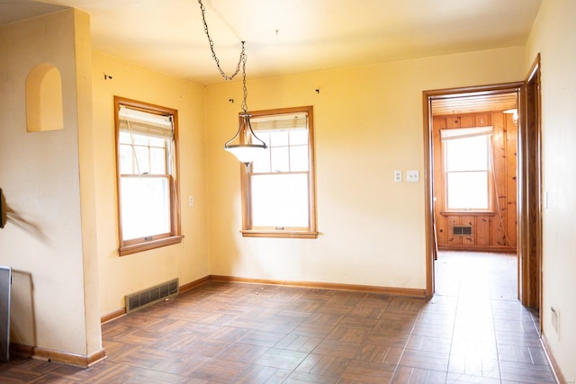 spare room featuring parquet floors