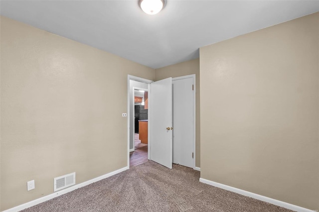 empty room with carpet flooring