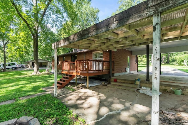 rear view of property with a deck and a yard