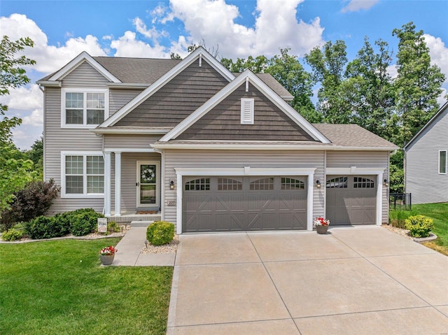 craftsman-style home featuring a front yard and a garage