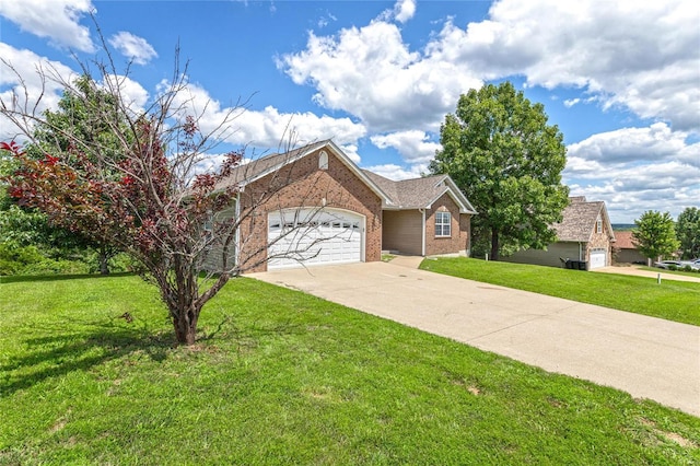 view of front of house with a garage and a front yard