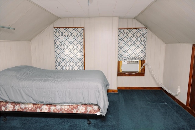 bedroom featuring dark carpet, cooling unit, wooden walls, and vaulted ceiling