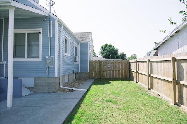 view of yard featuring cooling unit and a patio