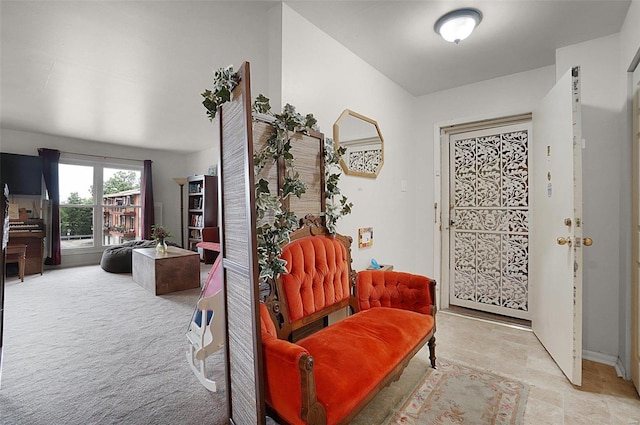 entrance foyer featuring light carpet