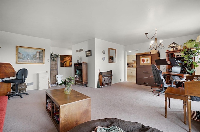 carpeted office with a notable chandelier