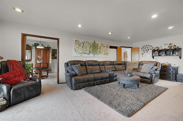 carpeted living room with ornamental molding