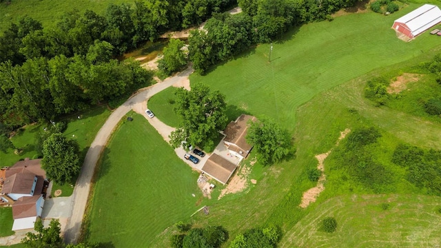 birds eye view of property with a rural view