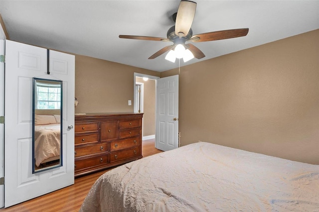 bedroom featuring light hardwood / wood-style floors and ceiling fan