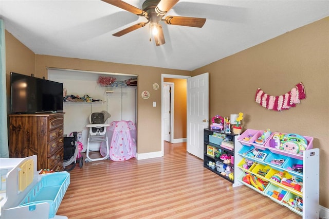 playroom featuring ceiling fan and hardwood / wood-style floors