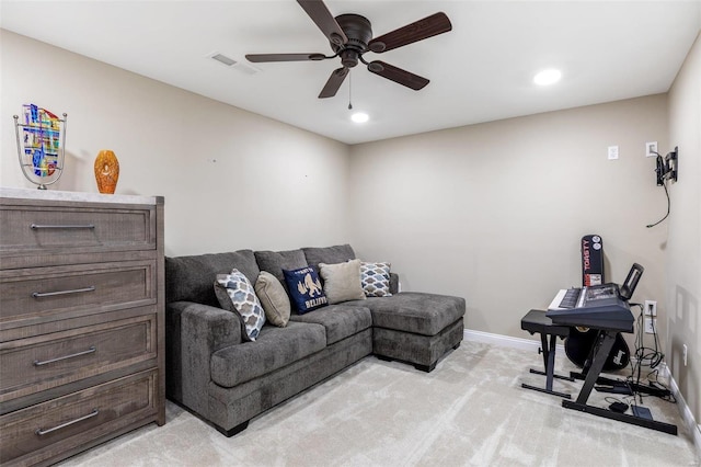 living room featuring ceiling fan and light carpet