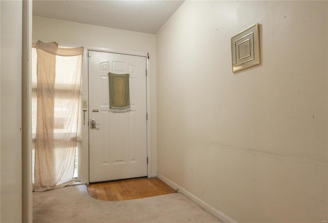 entryway with carpet floors