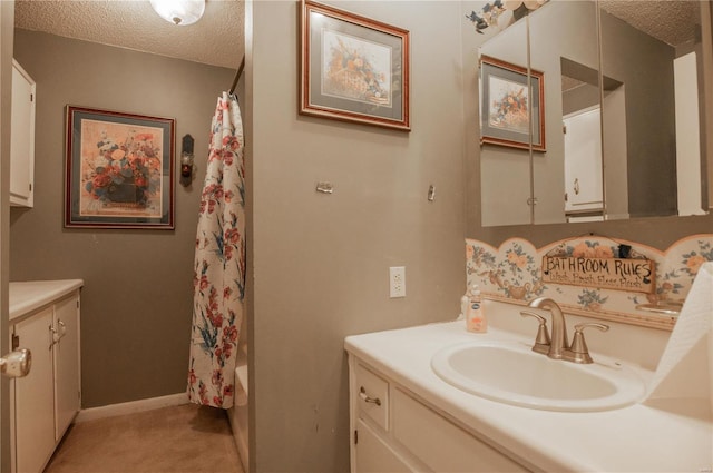 bathroom with vanity, a textured ceiling, and shower / bathtub combination with curtain