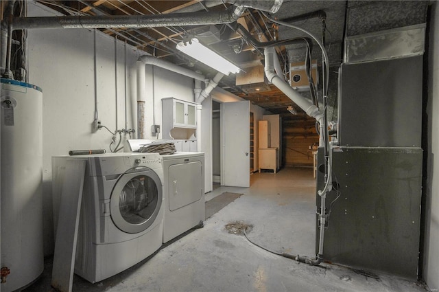 basement featuring independent washer and dryer and water heater