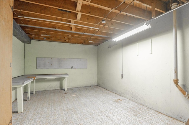 basement featuring light tile patterned floors