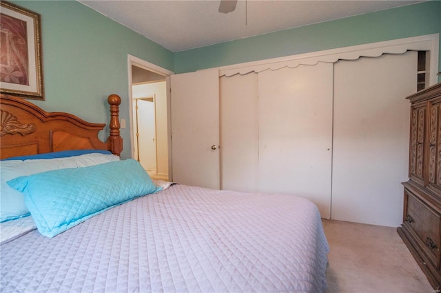 bedroom with light carpet and ceiling fan